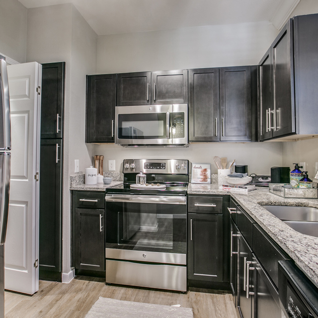 Essex House - Kitchen with Stainless Steel Appliances and Granite Countertops